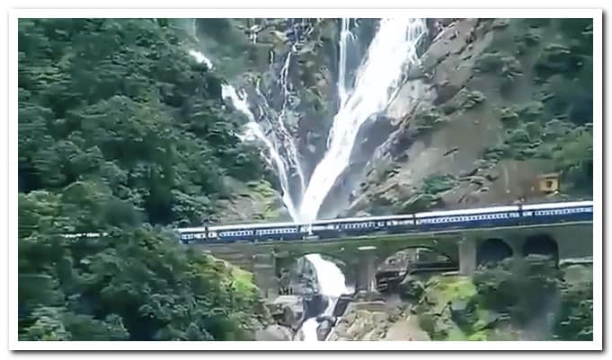 Train passing Dudhsagar falls