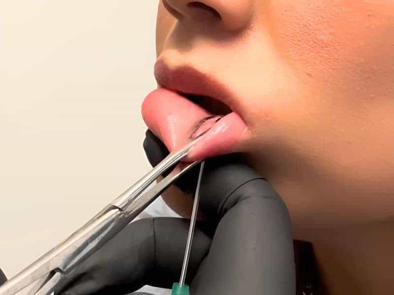 Oral piercing at 13th Hour Tattoos